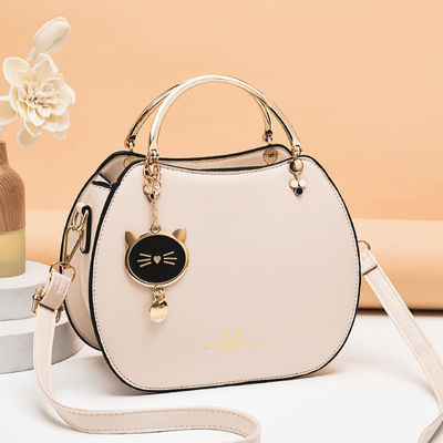 Trendy Single Shoulder Women's Handbag with Cat Pendant and Zipper Closure